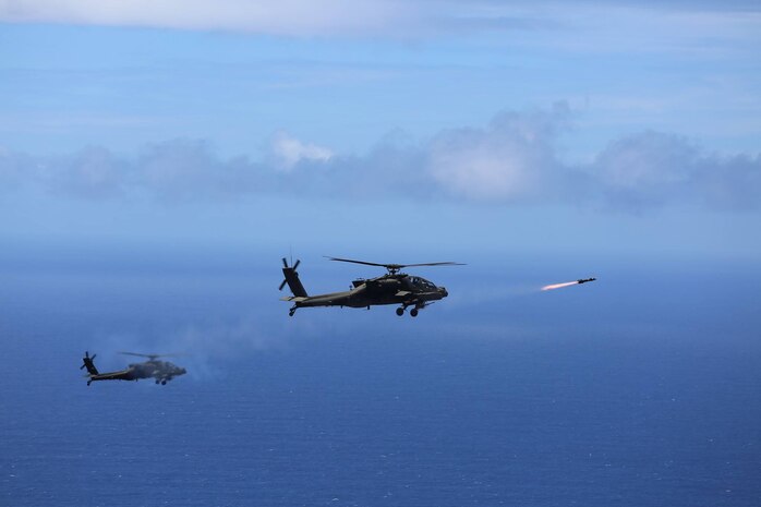 Two U.S. Army AH-64D Apache attack helicopters assigned to the 2-6 Cavalry Squadron, 25th Combat Aviation Brigade launch eight "fire and forget" AGM-114L Hellfire Air to Surface Missiles during a training exercise off the coast of Oahu as part of the Rim of the Pacific (RIMPAC) 2016. Exercise participants boosted their proficiency in tactics, targeting and live firing during a sinking exercise (SINKEX) with the decommissioned Pearl Harbor frigate USS Crommelin on July 19, 2016. 