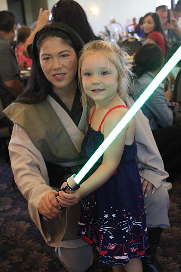 A Star Wars Jedi poses for a photo with a child during Recruiting Station Los Angeles’ Family Day at Naval Base Ventura County Port Hueneme, July 16, 2016. During the family day, volunteers from the 501st Legion Southern California Garrison dressed up as Star Wars characters, interacting with families. (U.S. Marine Corps photo by Staff Sgt. Alicia R. Leaders/Released)