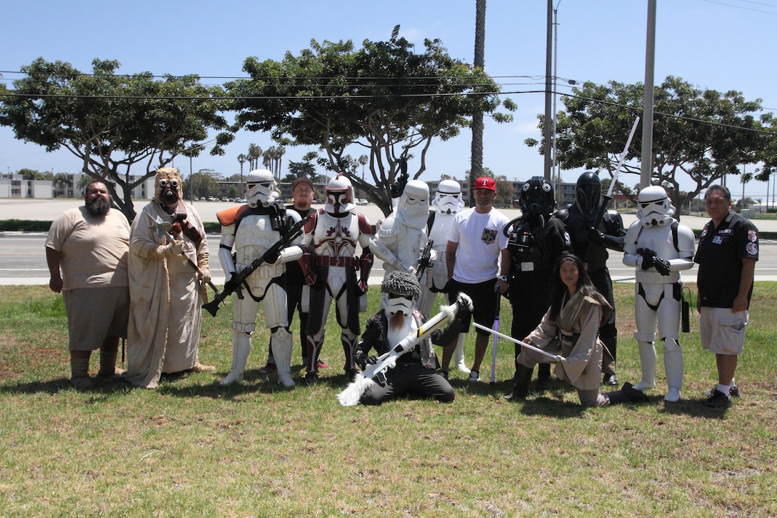 Gunnery Sgt. Jose A. Mireles, supply chief for Recruiting Station Los Angeles, poses for a photo with Star Wars characters during RS Los Angeles’ Family Day at Naval Base Ventura County Port Hueneme, July 16, 2016. Volunteers from the 501st Legion Southern California Garrison dressed up as Star Wars characters, interacting with families. (U.S. Marine Corps photo by Staff Sgt. Alicia R. Leaders/Released)