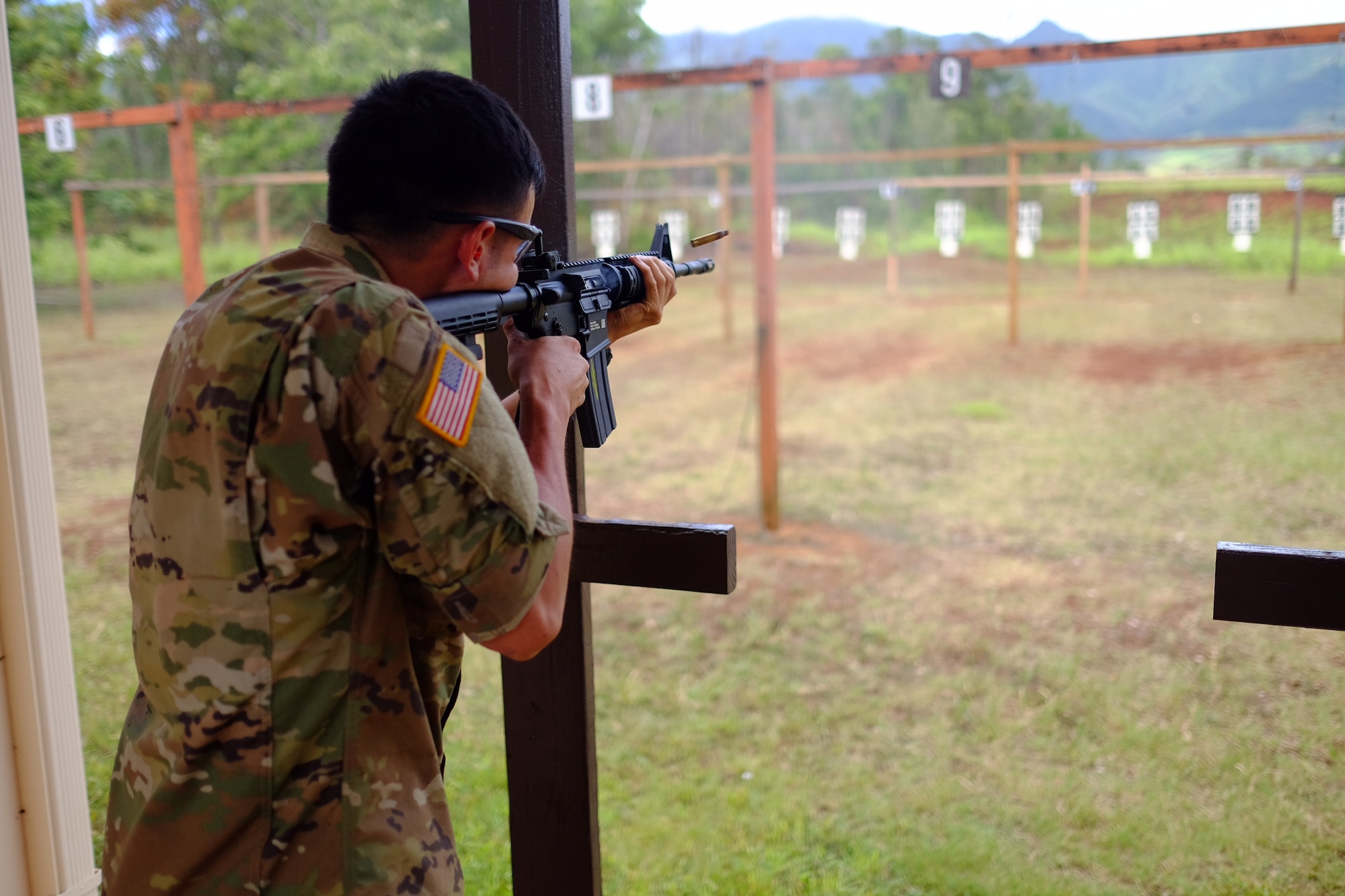 A soldier fires an M4 Carbine rifle toward his target during the Excellence in Competition M4 event on 15 July at Schofield Barracks, Hawaii. The event, which was held 13-15 July at the 647th SFS Combat Arms Firing Range, allowed would-be marksmen to test their abilities while using the Air Force standard-issue M4 carbine rifle. (U.S Air Force photo by Staff Sgt. Christopher Stoltz)
