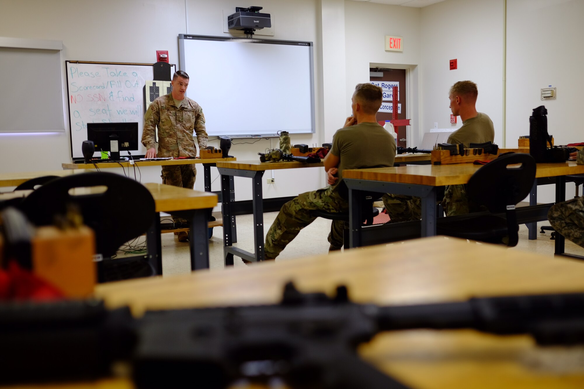 Staff Sgt. Derrick Koch, 647th Security Forces Squadron Combat Arms Training and Maintenance instructor, briefs a group of service members prior to firing during the Excellence in Competition M4 event on 15 July at Schofield Barracks, Hawaii. The event, which was held 13-15 July at the 647th SFS Combat Arms Firing Range, allowed would-be marksmen to test their abilities while using the Air Force standard-issue M4 carbine rifle. (U.S Air Force photo by Staff Sgt. Christopher Stoltz)