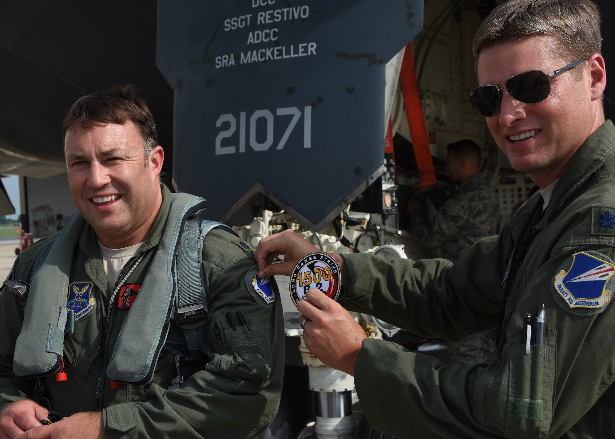 Lt. Col. Jared Kennish, 131st Operations Group commander, Missouri Air National Guard, is presented a 1500-hour patch by Lt. Col. Timothy Rezac, 110th Bomb Squadron commander, at Whiteman Air Force Base, Mo., July 9, 2016.  Kennish joins a small group of B-2 Spirit pilots that have surpassed the 1,000-hour milestone and currently has the most flying hours of any actively flying B-2 pilot.  (U.S. Air National Guard photo by Senior Master Sgt. Mary-Dale Amison)