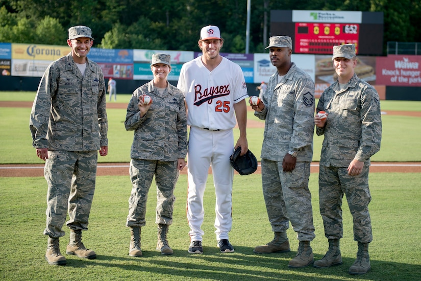 Airmen from Joint Base Andrews take a group photo with John Means, Bowie Baysox pitcher, before a Baysox game in Bowie, Md., July 15, 2016. This was the Baysox’s sixth Joint Base Andrews Military Appreciation Night. (U.S. Air Force photo by Airman 1st Class Philip Bryant)