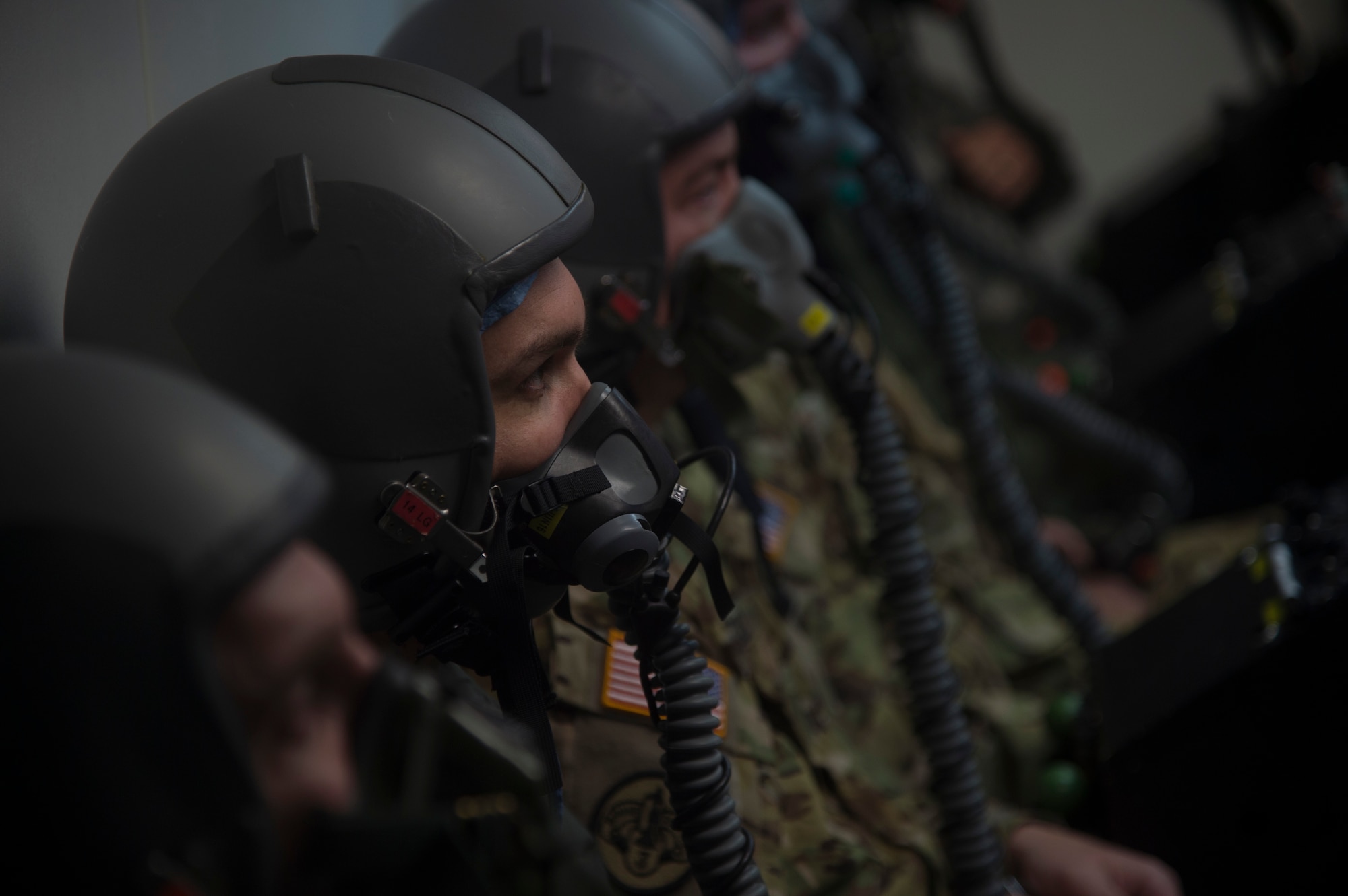 Capt. Raylind Bergman, 1st Helicopter Squadron instructor pilot and operations assistant flight commander, participates in altitude chamber training supervised by his wife, 1st Lt. Alethea Bergman, 79th Medical Wing aerospace and operational physiologist and operations element chief, at Joint Base Andrews, Md., July 6, 2016. The couple met in ROTC, married in 2010, and attributes their success both in the Air Force and in their marriage to their multiple shared common goals and ambitions. (U.S. Air Force photo by Senior Airman Mariah Haddenham)