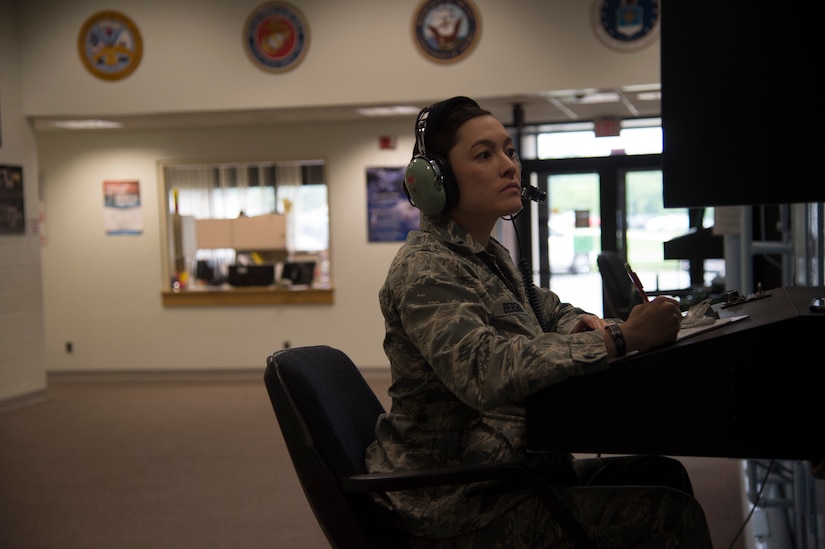 1st Lt. Alethea Bergman, 79th Medical Wing aerospace and operational physiologist and operations element chief, oversees altitude chamber training of pilots, including her husband, at Joint Base Andrews, Md., June, 2016. The couple met in ROTC, married in 2010, and attributes their success both in the Air Force and in their marriage to their multiple shared common goals and ambitions. (U.S. Air Force photo by Senior Airman Mariah Haddenham)
