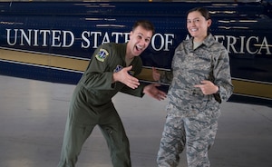 Capt. Raylind Bergman, 1st Helicopter Squadron instructor pilot and operations assistant flight commander, poses for a photo with his wife, 1st Lt. Alethea Bergman, 79th Medical Wing aerospace and operational physiologist and operations element chief, at Joint Base Andrews, Md., July 6, 2016. . The couple met in ROTC, married in 2010, and are expecting their first child this year. (U.S. Air Force photo by Senior Airman Mariah Haddenham)