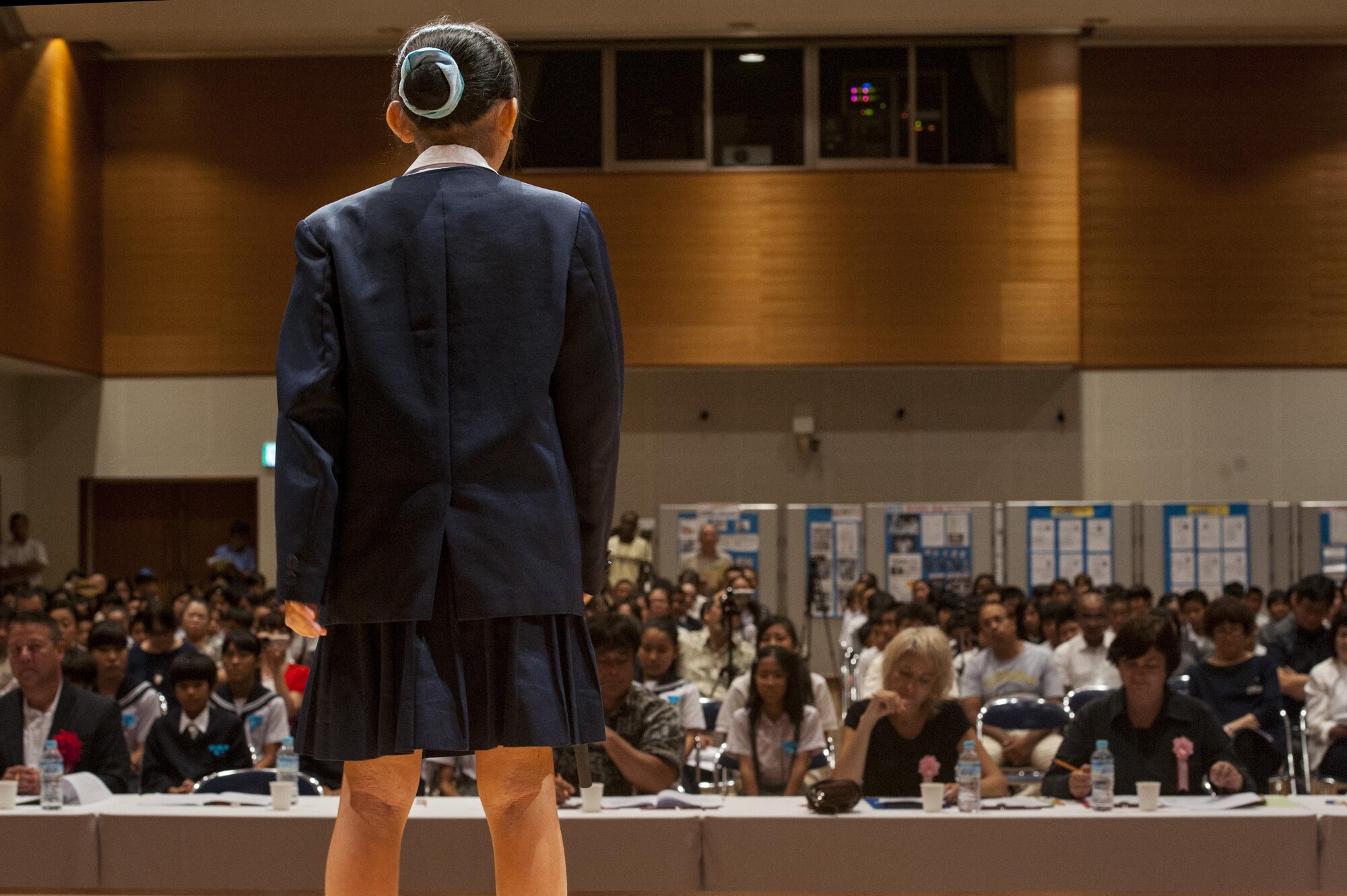 Moa Maetaba, Yara Elementary School sixth grade student, recites a story in English during the 19th annual Kadena Language Institute English Contest July 14, 2016, at Kadena Rotary Town Plaza, Okinawa, Japan. Students participating in the contest learned a story in English and had to recite it from memory. This contest is focused on inspiring children to pursue a future global partnership. (U.S. Air Force photo by Airman 1st Class Lynette M. Rolen)