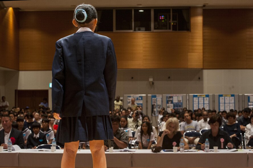 Moa Maetaba, Yara Elementary School sixth grade student, recites a story in English during the 19th annual Kadena Language Institute English Contest July 14, 2016, at Kadena Rotary Town Plaza, Okinawa, Japan. Students participating in the contest learned a story in English and had to recite it from memory. This contest is focused on inspiring children to pursue a future global partnership. (U.S. Air Force photo by Airman 1st Class Lynette M. Rolen)