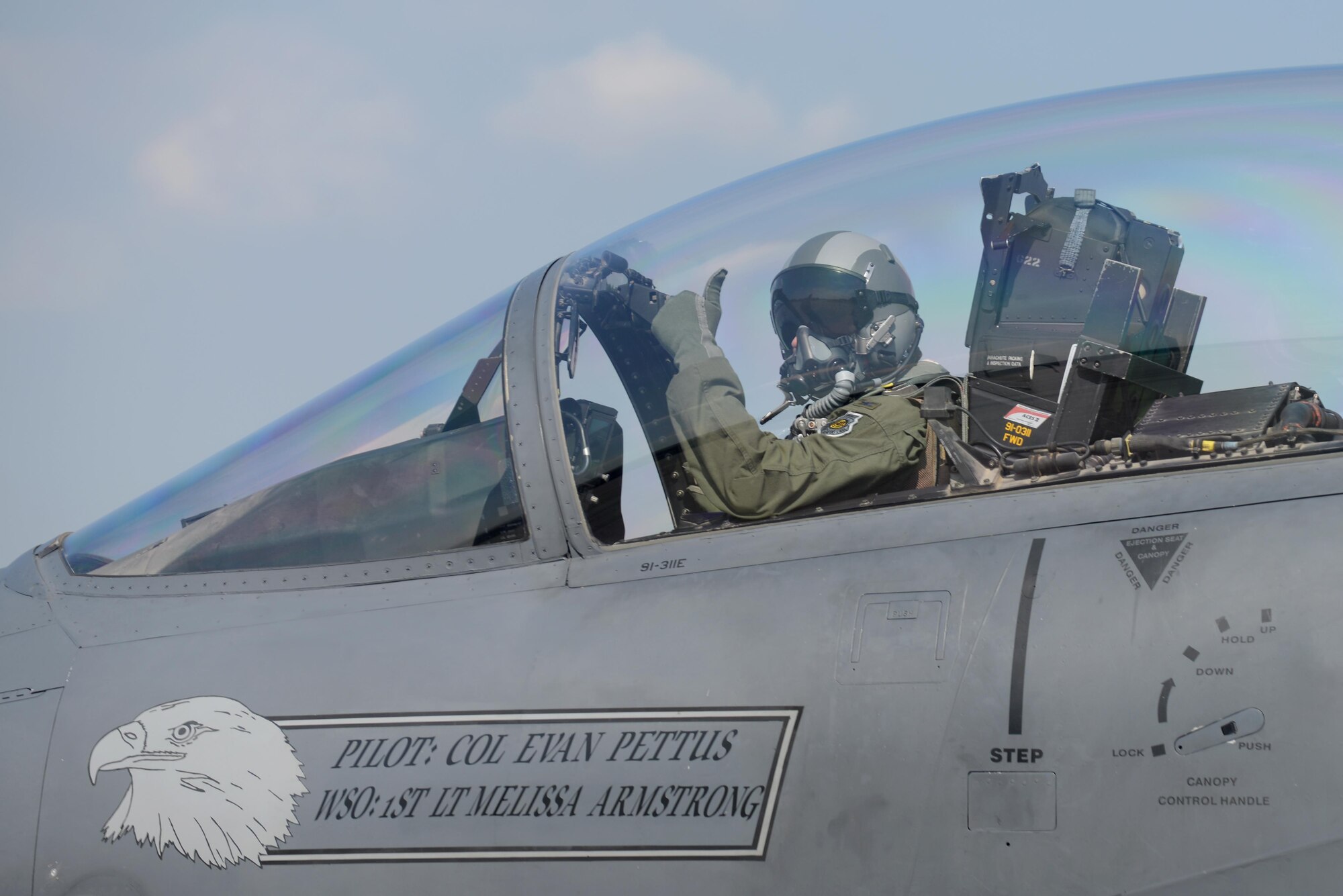 U.S. Air Force Col. Evan Pettus gives a thumbs up after completing his pre-flight checks prior to his first flight as the 48th Fighter Wing commander at Royal Air Force Lakenheath, England, July 20. Pettus assumed command of the 48th FW on July 19, and has logged 2,200 flight hours in the F-15E Strike Eagle(U.S. Air Force photo/ Airman Eli Chevalier)