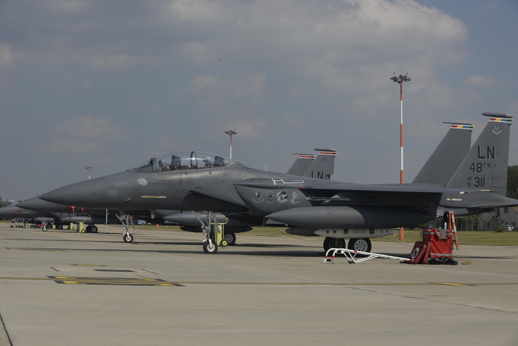 U.S. Air Force Col. Evan Pettus runs through his pre-flight checks prior to his first flight as the 48th Fighter Wing commander at Royal Air Force Lakenheath, England, July 20. Pettus assumed command of the 48th FW on July 19, and has logged 2,200 flight hours in the F-15E Strike Eagle(U.S. Air Force photo/Airman 1st Class Abby L. Finkel)