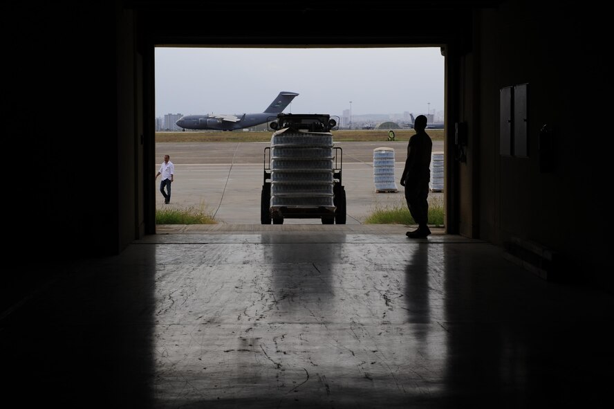 Airmen use a forklift to carry pallets of water into a storage facility July 19, 2016, at Incirlik Air Base, Turkey. A recent loss of commercial power prompted a delivery of fuel, food and water to sustain missions supporting Operation Inherent Resolve. (U.S. Air Force photo by Airman 1st Class Devin M. Rumbaugh)