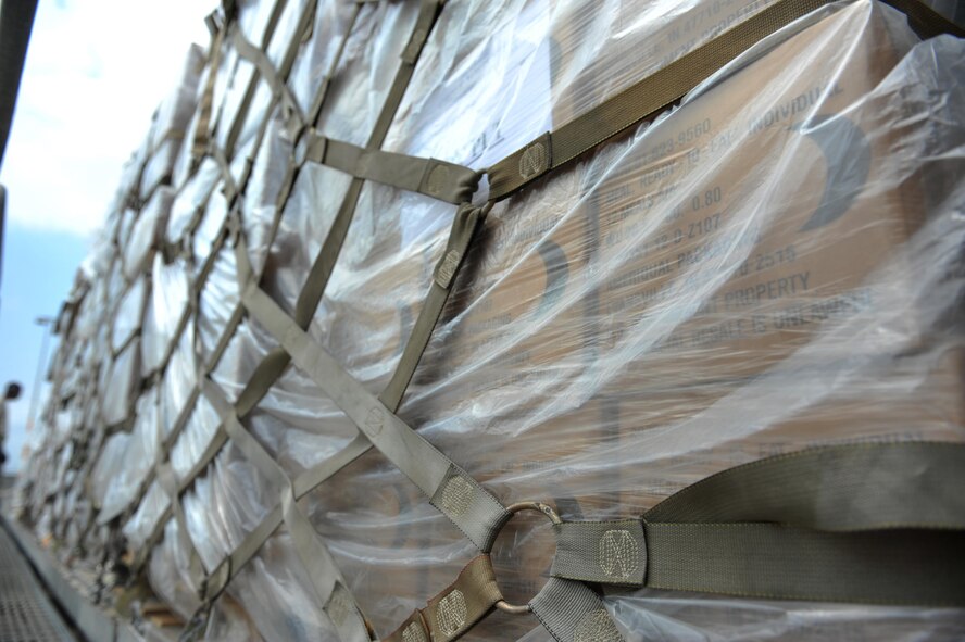 Pallets of meals, ready to eat sit on a roller platform waiting for distribution July 19, 2016, at Incirlik Air Base, Turkey. Meals, water, fuel and other supplies were delivered to sustain missions supporting Operation Inherent Resolve after an extended loss of commercial power to the base. (U.S. Air Force photo by Tech. Sgt. Joshua T. Jasper)