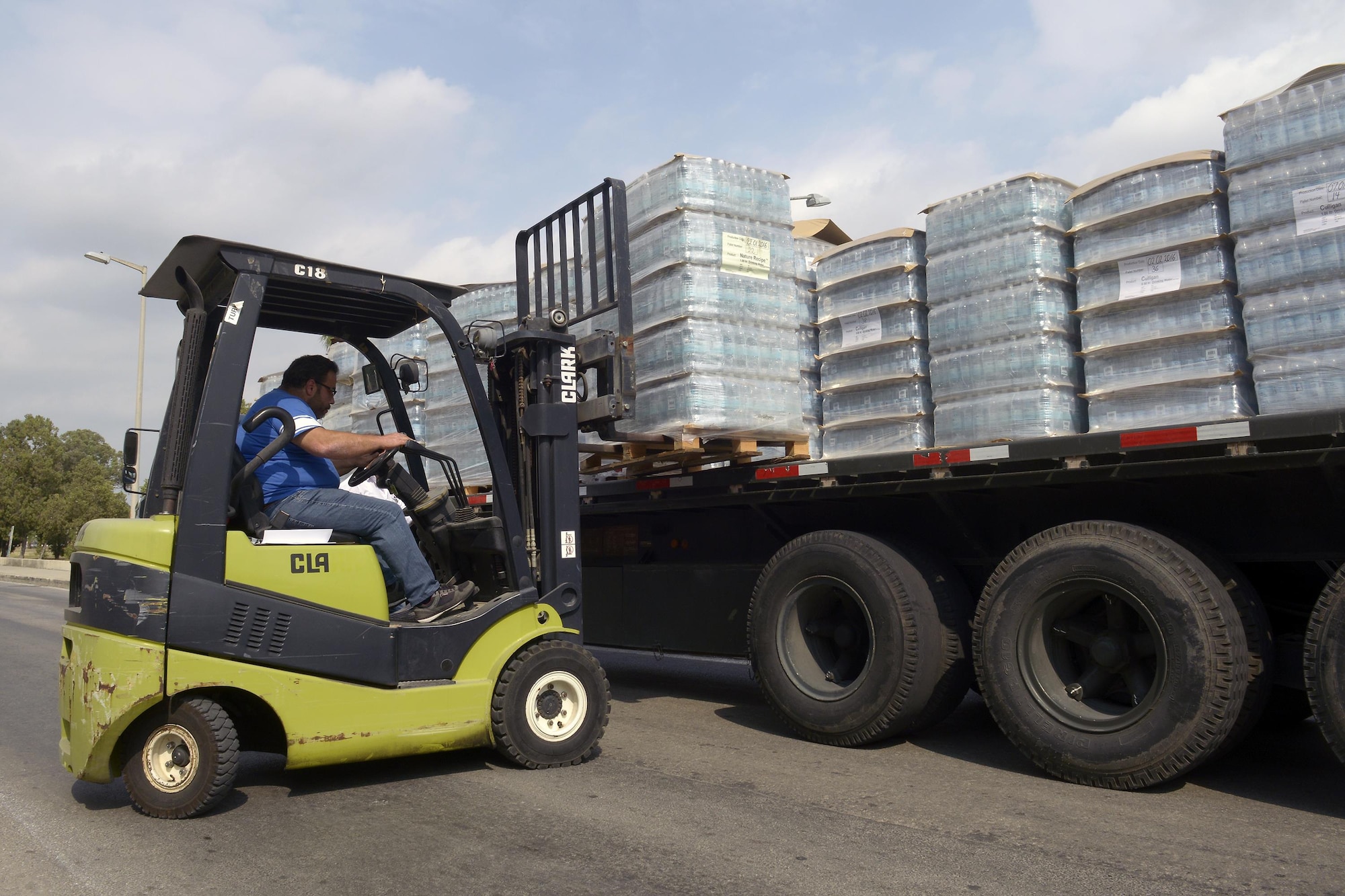 Pallets of water are loaded onto a truck for relocation July 19, 2016, on Incirlik Air Base, Turkey.  The base received many different supplies including food, fuel and water after an extended commercial power outage caused a break in the normal supply chain. (U.S. Air Force photo by Master Sgt. Derrick C. Goode) 