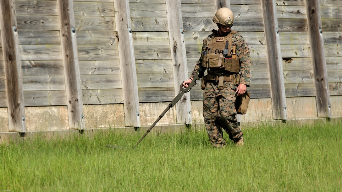 Sgt. David Jones, an explosive ordnance disposal team leader with 2nd EOD Company, 8th Engineer Support Battalion, scans the EOD lane for signs of an improvised explosive device during a training exercise at Marine Corps Base Camp Lejeune, N.C., July 19, 2016. The unit conducted the training to test the effects of different types of excavation charges. (U.S. Marine Corps photo by Lance Cpl. Victoria Ross)