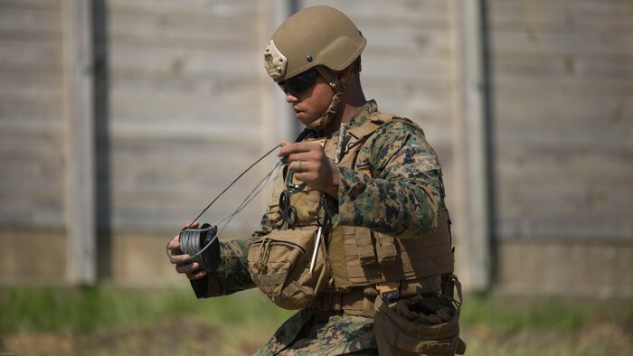 Sgt. Anthony Carbajal, an explosive ordnance disposal team leader with 2nd EOD Company, 8th Engineer Support Battalion, works on a safe detonating procedure during a training exercise at Marine Corps Base Camp Lejeune, N.C., July 19, 2016. The unit conducted the training to test the effects of different types of excavation charges. 