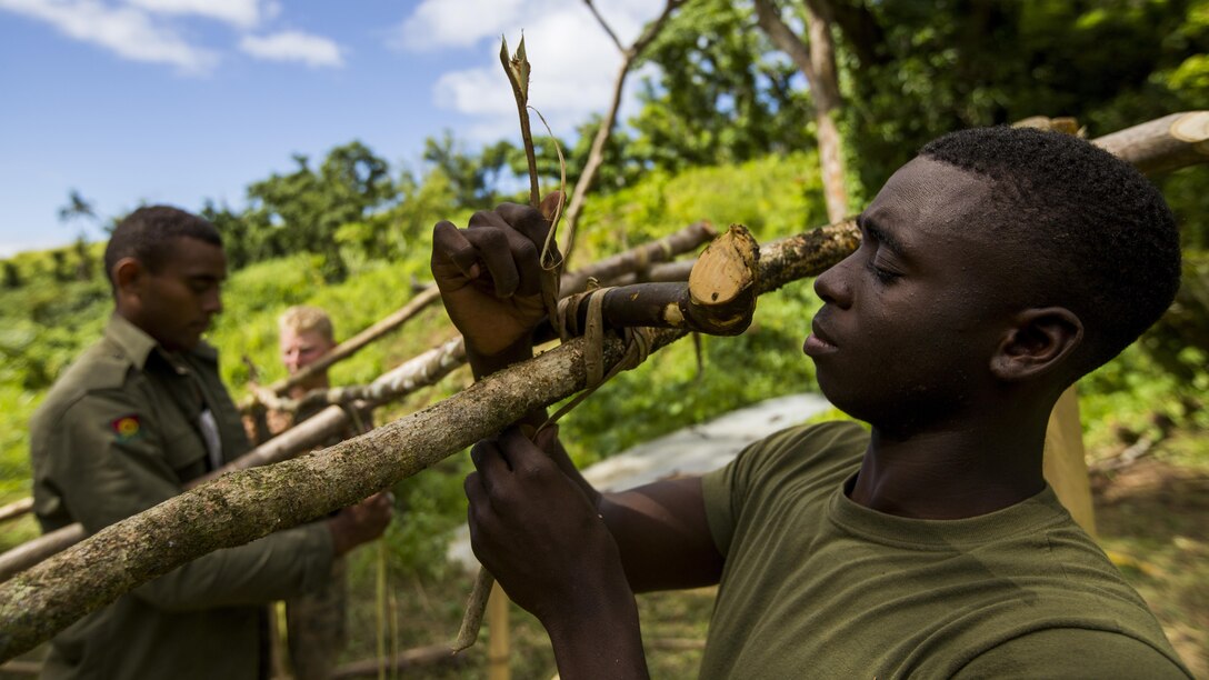 U.S. Marine Lance Cpl. Terrance L. Lee with Task Force Koa Moana 16.2 constructs a shelter from surrounding vegetation during jungle survival training on Ovalau, Fiji, July 15, 2016. Marines applied survival techniques they have learned throughout their training with the RFMF. Fiji is part of Task Force Koa Moana’s deployment throughout the Asia-Pacific region, where Marines and Sailors will share engineering and infantry skills with the RFMF to strengthen mil-to-mil relationships and interoperability.