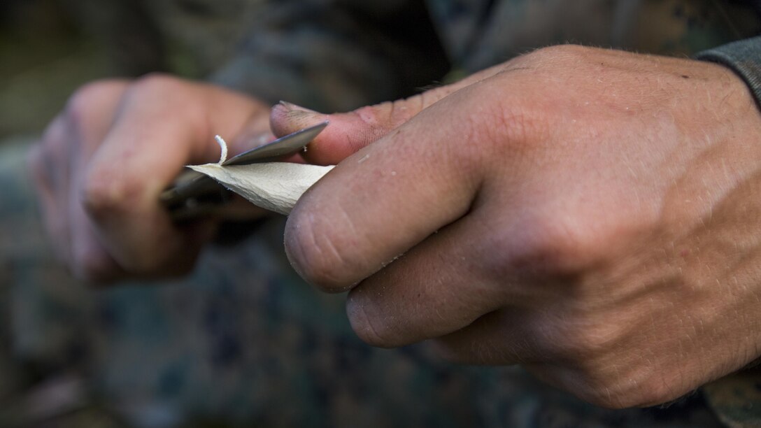 U.S. Marine Pfc. Tyler 1Armentaro with Task Force Koa Moana 16.2, sharpens his wooden spear during jungle survival training on Ovalau, Fiji, July 15, 2016. Marines applied survival techniques they have learned throughout their training with the RFMF. Fiji is part of Task Force Koa Moana’s deployment throughout the Asia-Pacific region, where Marines and Sailors will share engineering and infantry skills with the RFMF to strengthen mil-to-mil relationships and interoperability.