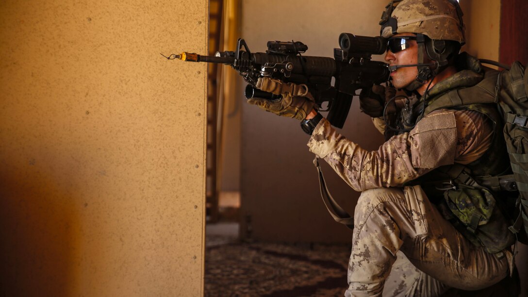 A Canadian service member post security in a training city during a clearing city exercise at Marine Corps Base Camp Pendleton, California, July 19, 2016. The training was conducted with U.S., Chilean, and Canadian service members to enhance interoperability between partner nations. Twenty-six nations, more than 40 ships and submarines, more than 200 aircraft and 25,000 personnel are participating in RIMPAC from June 30 to Aug. 4, in and around the Hawaiian Islands and Southern California. The world's largest international maritime exercise, RIMPAC provides a unique training opportunity that helps participants foster and sustain the cooperative relationships that are critical to ensuring the safety of sea lanes and security on the world's oceans. RIMPAC 2016 is the 25th exercise in the series that began in 1971.