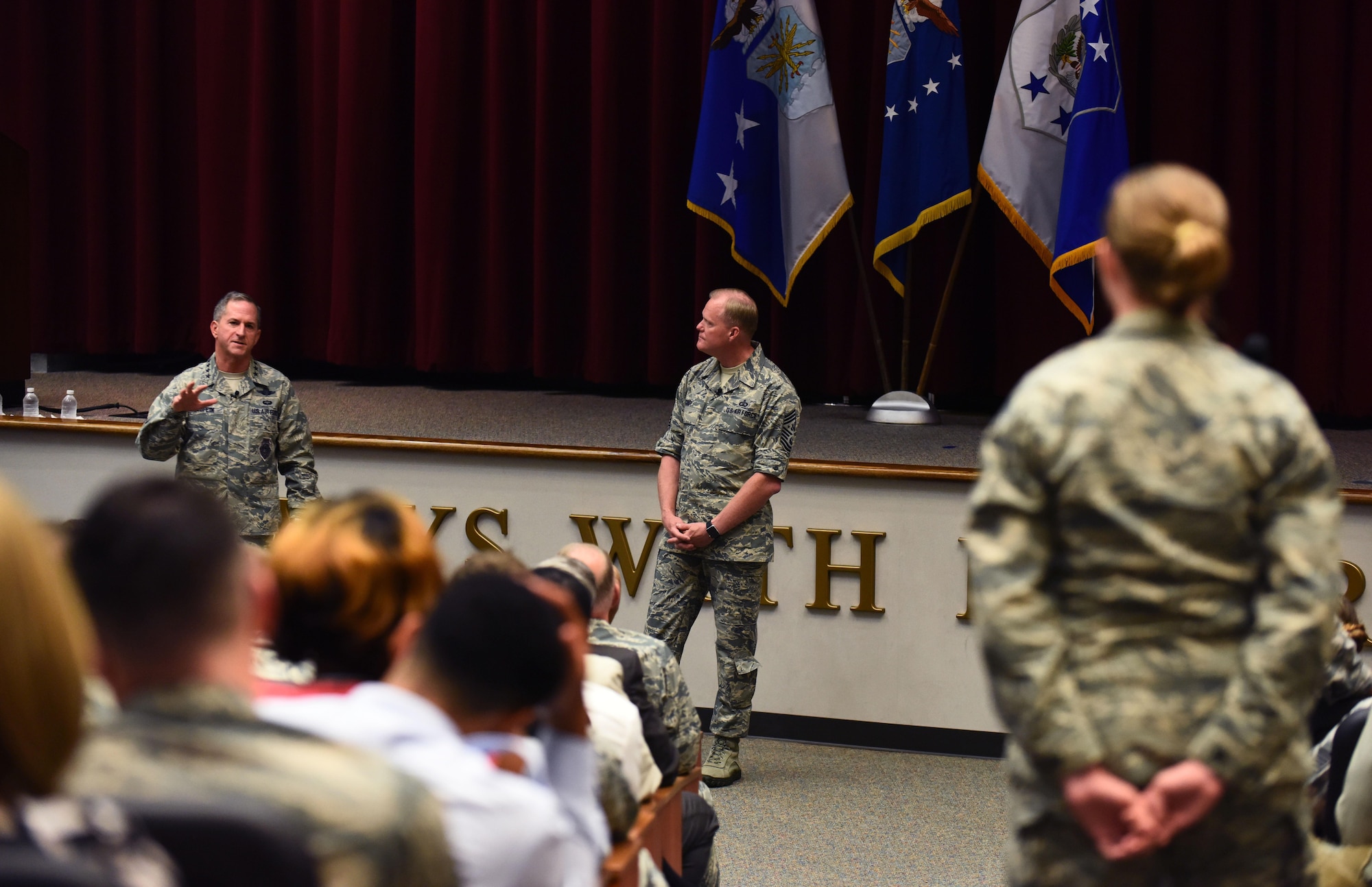 An Airman from Maxwell Air Force Base, Ala., asks Air Force Chief of Staff Gen. David L. Goldfein and Chief Master Sgt. of the Air Force James A. Cody a question during a town hall event July 20, 2016. The Air Force’s two most senior leaders answered multiple questions from the audience, addressing the Airmen’s concerns. (U.S. Air Force photo/Senior Airman Hailey Haux)