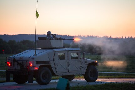 U.S. Army Soldiers from the 329th Combat Sustainment Support Battalion conduct a night live fire exercise using M2 Browning, .50 Caliber Machine Guns mounted on High Mobility Multipurpose Wheeled Vehicles (HMMWV) during Warrior Exercise (WAREX) 86-16-03 at Fort McCoy, Wis., July 13, 2016. WAREX is designed to keep soldiers all across the United States ready to deploy. (U.S. Army photo by Spc. John Russell/Released)