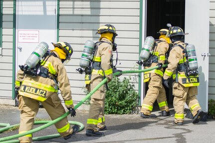 U.S. Army Soldiers (from left) Spc. Nicholas Kudlacz, Spc. Kenneth Young, Spc. Brandon Tauzin, Spc. Andrew Cuva, with the 294th Engineer Detachment, 467th Engineer Battalion, Creston, Iowa, participate in firefighting training during Warrior Exercise (WAREX) 86-16-03 at Fort McCoy, Wis., July 19, 2016. WAREX is designed to keep soldiers all across the United States ready to deploy. (U.S. Army photo by Spc. Cody Hein/Released)