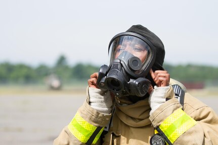 U.S. Army Sgt. Michael Berry, 294th Engineer Detachment, 467th Engineer Battalion, Creston, Iowa, checks for a tight seal around his mask as he prepares for a firefighting training event during Warrior Exercise (WAREX) 86-16-03 at Fort McCoy, Wis., July 19, 2016. WAREX is designed to keep soldiers all across the United States ready to deploy. (U.S. Army photo by Spc. Cody Hein/Released)