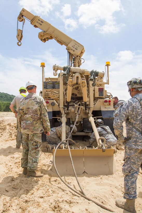 U.S. Army Soldiers with the 950th Support Maintenance Company, 311th Expeditionary Sustainment Command, Los Alamitos, Calif.  prepare an M984A4 Recovery Truck to complete a vehicle recovery during Warrior Exercise (WAREX) 86-16-03 at Fort McCoy, Wis., July 19, 2016. WAREX is designed to keep soldiers all across the United States ready to deploy. (U.S. Army photo by Spc. Cody Hein/Released)