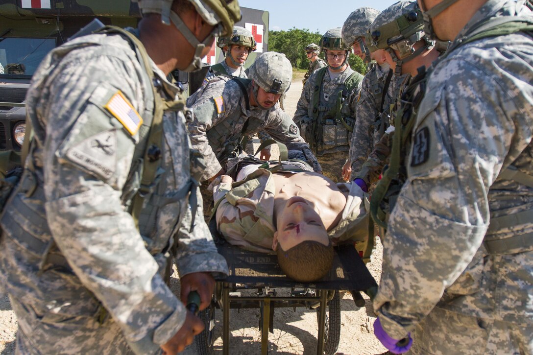 U.S. Army Soldiers from the 452nd Combat Support Hospital, Milwaukee, Wis., conduct a simulated mass-casualty incident during Warrior Exercise (WAREX) 86-16-03 at Fort McCoy, Wis., July 19, 2016. WAREX is designed to keep soldiers all across the United States ready to deploy. (U.S. Army photo by Spc. Cody Hein/Released)