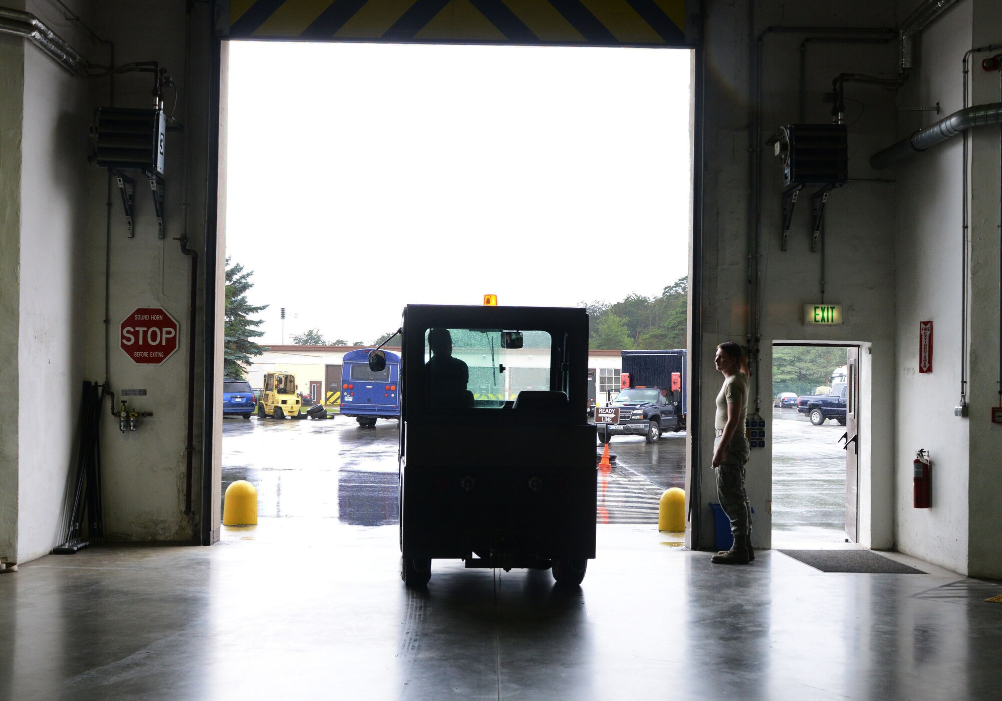 A tug vehicle exits a maintenance shop the 86th Vehicle Readiness Squadron July 13, 2016, at Ramstein Air Base. Tugs are used to push vehicles with mechanical issues to areas where they are maintained. (U.S. Air Force photo/ Airman 1st Class Joshua Magbanua)