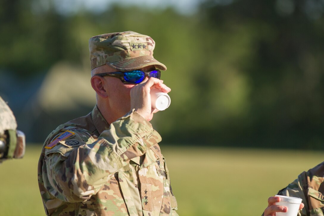 The 968th Quartermaster Company, Irvine, Calif., shares purified water samples with Lieutenant General Charles Luckey, Commanding General of the U.S. Army Reserve Command, during Warrior Exercise (WAREX) 86-16-03 at Fort McCoy, Wis., July 19, 2016. WAREX is designed to keep soldiers all across the United States ready to deploy. (U.S. Army photo by Spc. Cody Hein/Released)