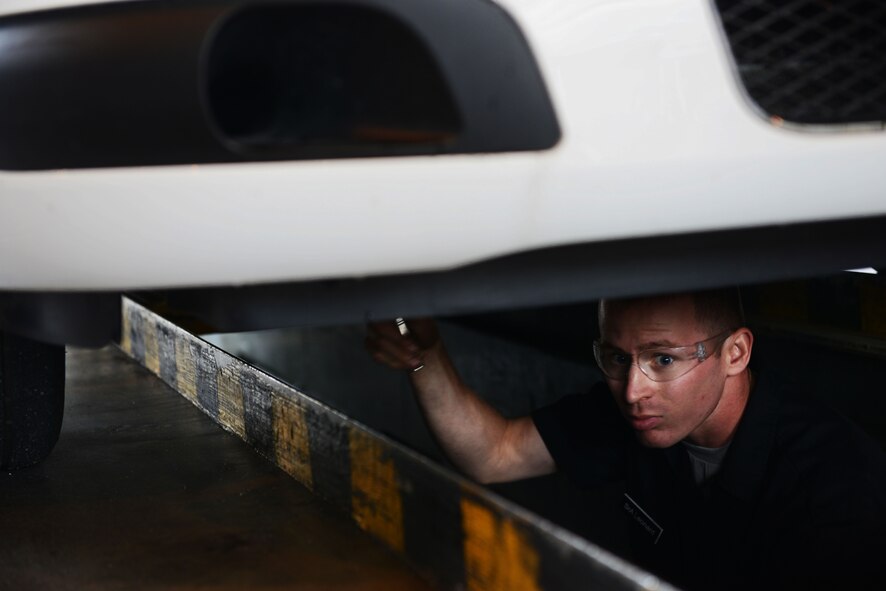 Senior Airman Ryan Leonard, 86th Vehicle Readiness Squadron vehicle maintainer, conducts maintenance work on a police vehicle at Ramstein Air Base, Germany, July 13, 2016. Airmen working at the 86th VRS must possess broad knowledge on a wide variety of vehicles made by different manufacturers. (U.S. Air Force photo/ Airman 1st Class Joshua Magbanua)