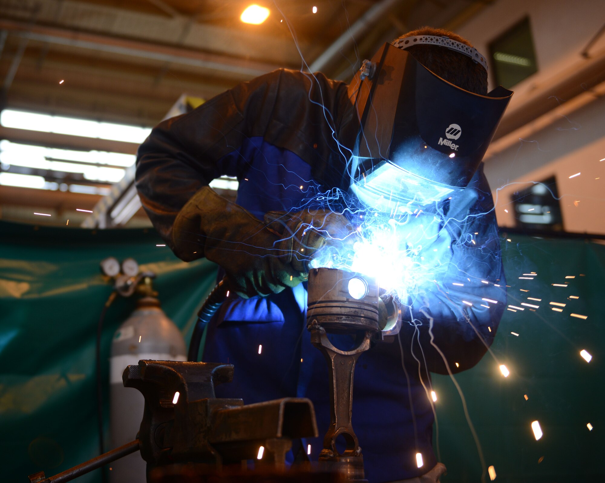 Senior Airman Adam Longfellow, 86th Vehicle Readiness Squadron vehicele maintainer, welds a friction plate at Ramstein Air Base, Germany, July 13, 2016. Airmen at the 86th VRS are responsible for ensuring Ramstein’s government-owned vehicles are properly maintained and in proper working condition. (U.S. Air Force photo/ Airman 1st Class Joshua Magbanua)