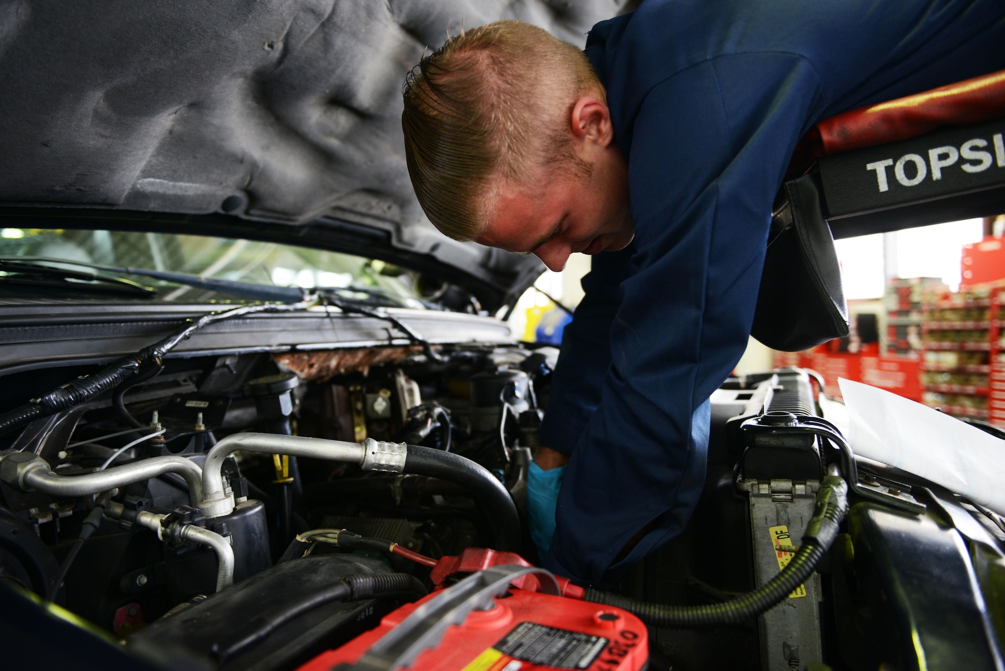 Airman 1st Class Mike Park, 86th Vehicle Readiness Squadron vehicle maintainer, guides a truck to prepare it for maintenance at Ramstein Air Base, Germany, July 13, 2016. Units all around Ramstein send their government-owned vehicles to the 86th VRS for maintenance. (U.S. Air Force photo/ Airman 1st Class Joshua Magbanua)