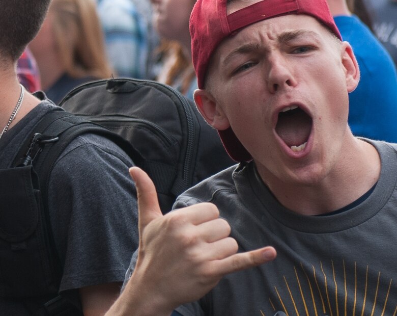 Airman 1st Class Alex Carson, 86th Security Forces Squadron member, cheers during an Eli Young Band concert July 16, 2016, at Ramstein Air Base, Germany. The Kaiserslautern Military Community was rewarded for serving the most wings during Pizza Hut’s “Wing-A-Palooza” challenge for all overseas military installations’ Pizza Huts. (U.S. Air force photo/Airman 1st Class Lane T. Plummer)