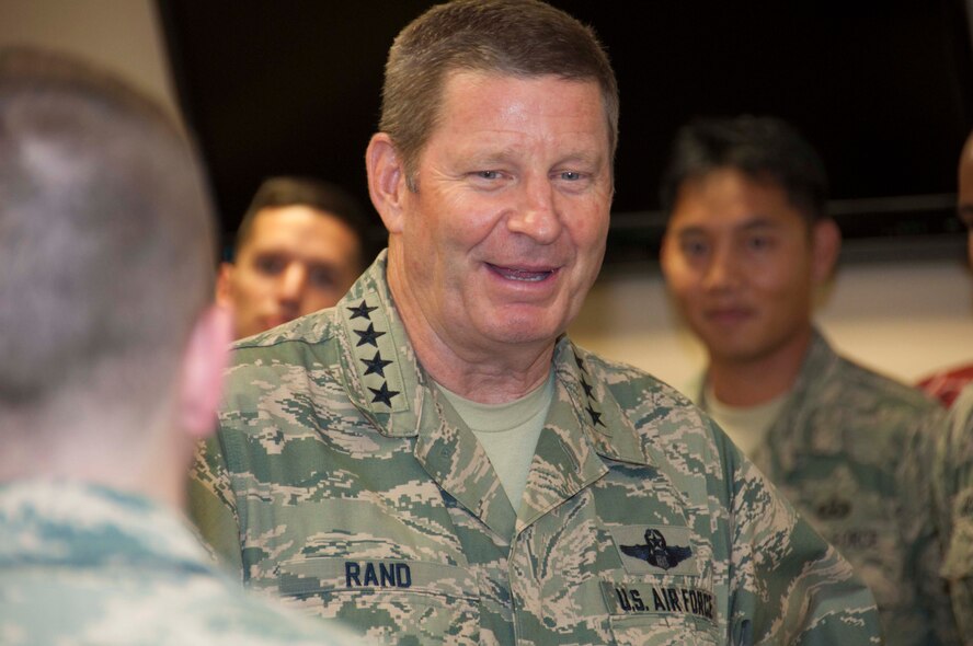 U.S. Air Force Gen. Robin Rand, Air Force Global Strike Command commander, smiles while speaking with Airmen of the 307th Operations Support Squadron at Barksdale Air Force Base, La., July 19, 2016.  Rand took time to answer questions and address concerns from several Airmen during his visit.  In his conversation, Rand stressed the need for finding balance between work and life and using critical thinking skills to improve mission efficiency.  (U.S. Air Force photo by Tech. Sgt. Ted Daigle)