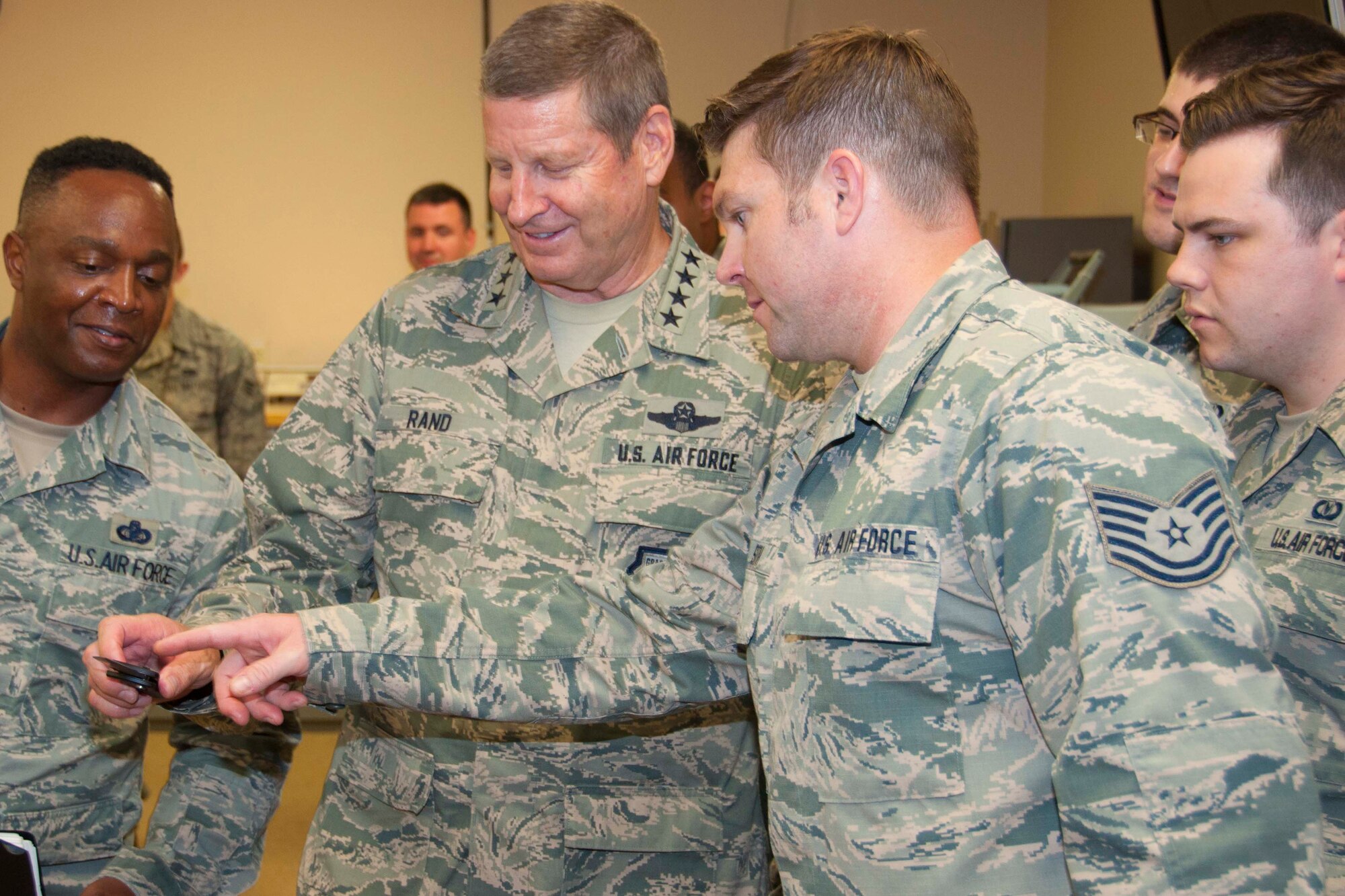 U.S. Air Force Airmen of the 307th Operations Support Squadron show Gen. Robin Rand, Air Force Global Strike Command commander, and Chief Master Sgt. Calvin Williams, AFGSC command chief, some of the tools of the trade at Barksdale Air Force Base, La., July 19, 2016.  Rand took time to visit several sections of the 307th OSS, fielding questions and addressing issues raised by the Airmen.  (U.S. Air Force photo by Tech. Sgt. Ted Daigle)