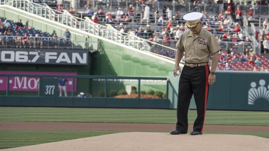 Commandant of the Marine Corps Gen. Robert B. Neller prepares to throw a baseball during a baseball game at Nationals Park, Washington, D.C., July 20, 2016. Neller threw the ceremonial first pitch at the Washington National’s annual game honoring the Marine Corps.
