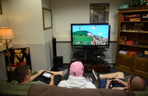 Airmen play a video game at the Club 7 on Ramstein Air Base, Germany, July 15, 2016. Club 7, a ministry of Ramstein’s chapel community, is open to Airmen E-4 and below. (U.S. Air Force photo/ Airman 1st Class Joshua Magbanua)