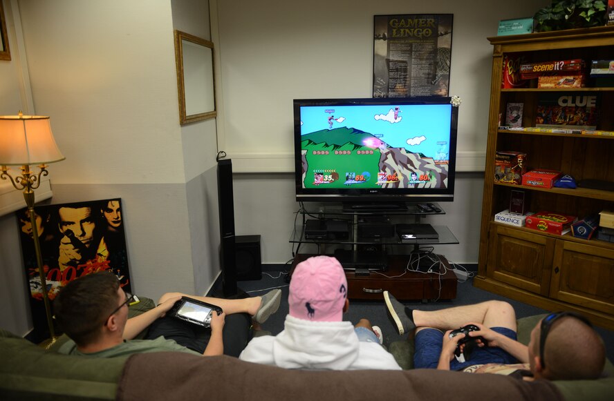 Airmen play a video game at the Club 7 on Ramstein Air Base, Germany, July 15, 2016. Club 7, a ministry of Ramstein’s chapel community, is open to Airmen E-4 and below. (U.S. Air Force photo/ Airman 1st Class Joshua Magbanua)