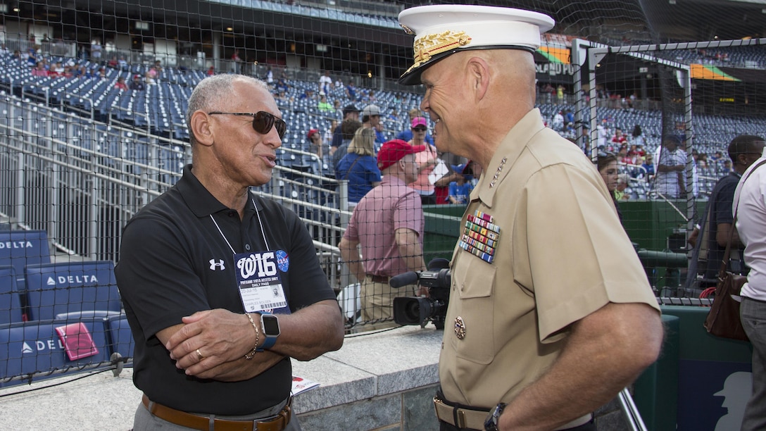 Commandant of the Marine Corps Gen. Robert B. Neller, left, speaks to NASA administrator and retired Marine Charles Bolden, before a baseball game at Nationals Park, Washington, D.C., July 20, 2016. Neller threw the ceremonial first pitch at the Washington National’s annual game honoring the Marine Corps. 