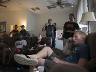 Airmen watch a movie at Club 7 on Ramstein Air Base, Germany, 2016. The Airman ministry center opens its doors to Airmen E-4 and below with the purpose of helping them build community ties and develop their spiritual life. (U.S. Air Force photo/ Airman 1st Class Joshua Magbanua)