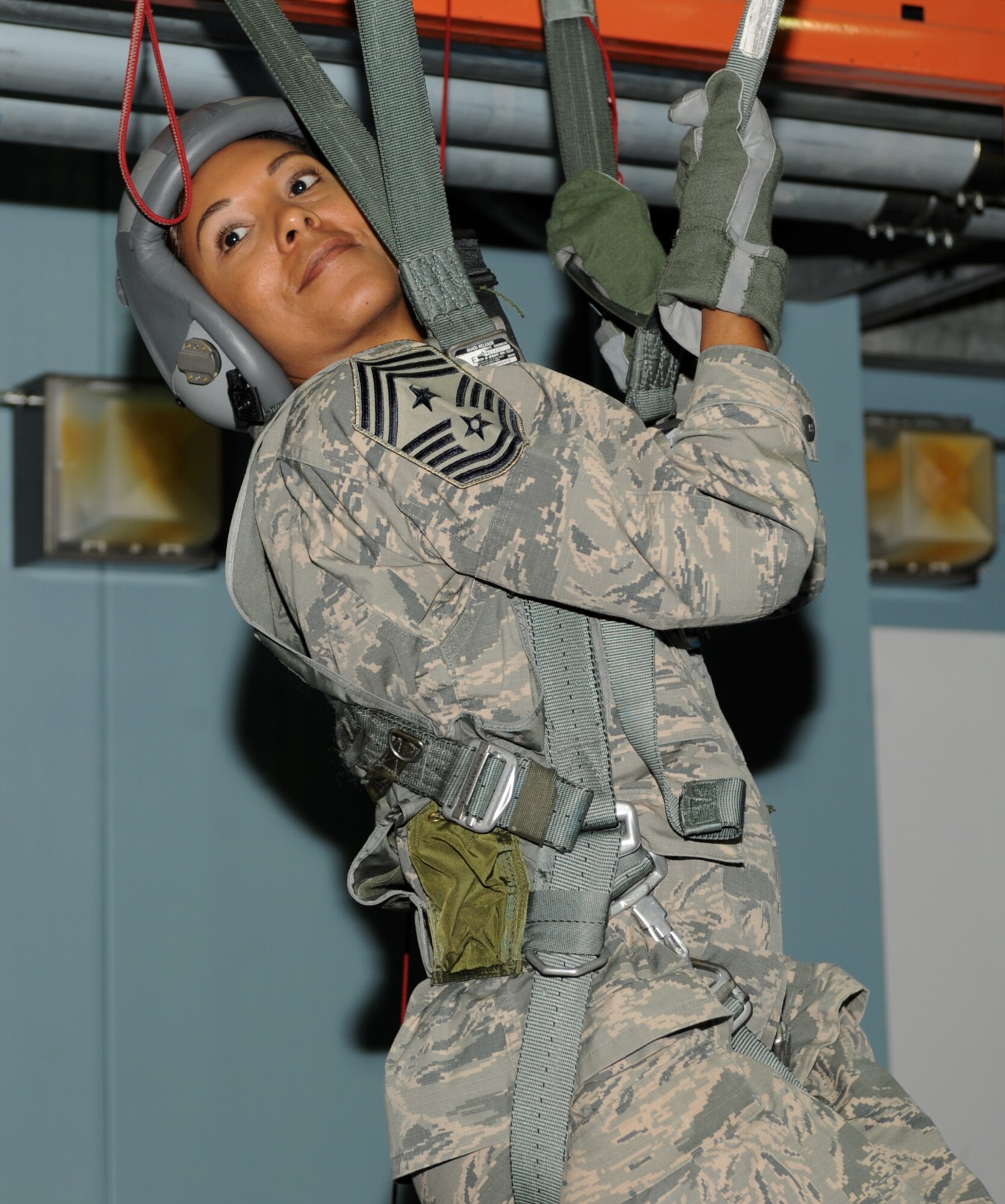 Chief Master Sgt. Sonia Lee, the command chief of the 28th Bomb Wing, practices different parachute steering methods as part of pre-flight training at Ellsworth Air Force Base, S.D., July 13, 2016. Lee learned how to identify different types of parachute malfunctions, how to fix them, and how to properly land after a fall. (U.S. Air Force photo by Airman 1st Class Denise M. Nevins)  