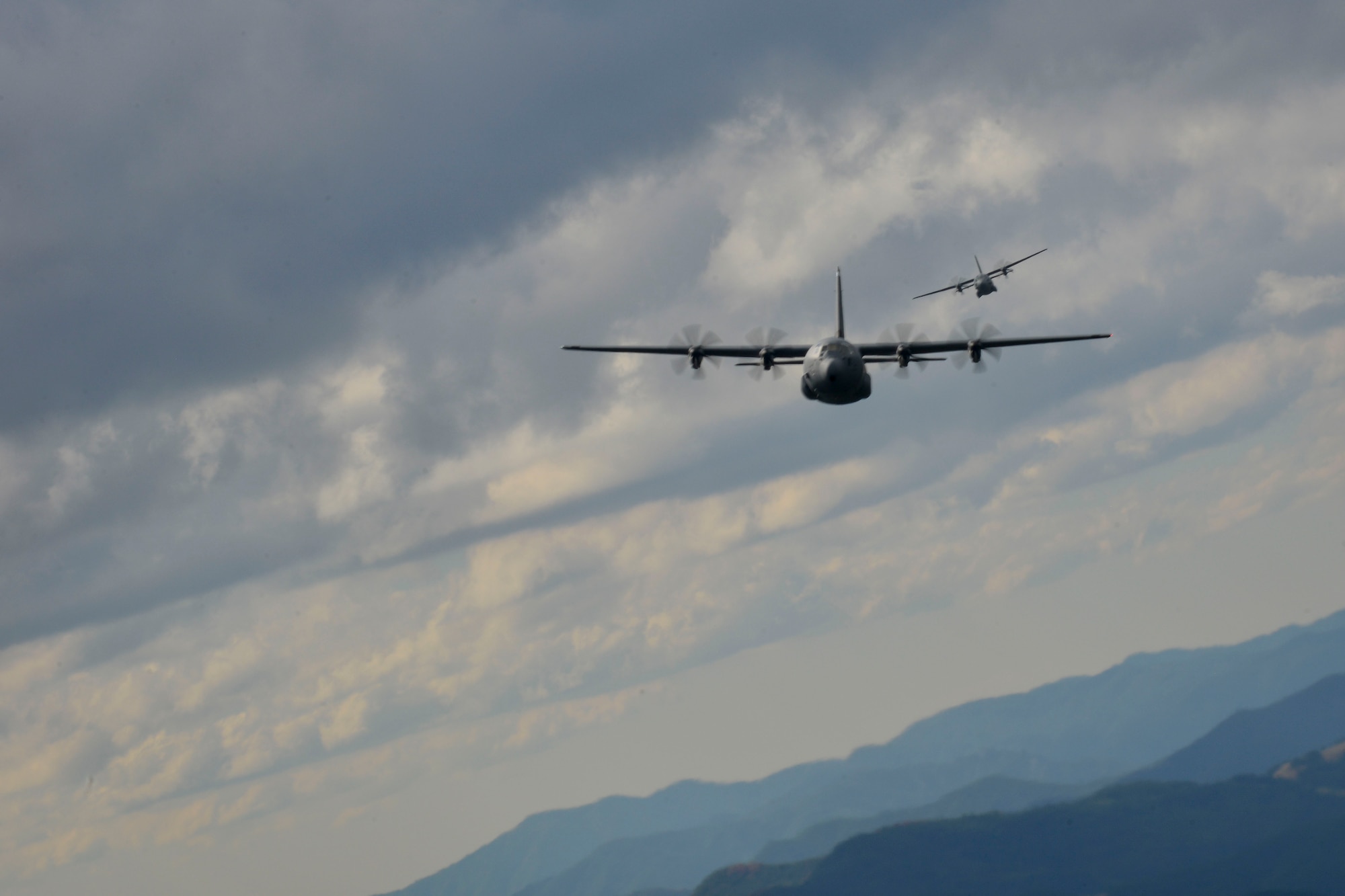 A U.S. Air Force C-130J Super Hercules and a Bulgarian air force C-47J Spartan fly over Plovdiv, Bulgaria during exercise Thracian Summer 2016, July 20, 2016. Through Exercise Thracian Summer, the United States and Bulgaria will enhance their mutual abilities to work together, with other NATO nations and with key regional partners on regional security, and help prepare Bulgaria for potential future operations in support of contingency operations around the world. The U.S. values the shared commitment and close cooperation with Bulgaria and other NATO allies on countering a range of regional and global threats. (U.S. Air Force photo/Senior Airman Nicole Keim) 