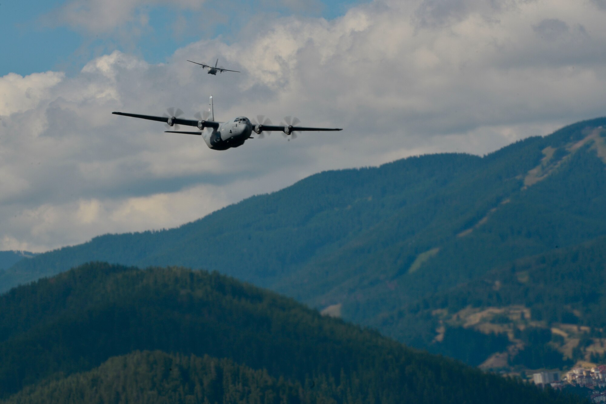 A U.S. Air Force C-130J Super Hercules and a Bulgarian air force C-47J Spartan fly over Plovdiv, Bulgaria during exercise Thracian Summer 2016, July 20, 2016. Through Exercise Thracian Summer, the United States and Bulgaria will enhance their mutual abilities to work together, with other NATO nations and with key regional partners on regional security, and help prepare Bulgaria for potential future operations in support of contingency operations around the world. The U.S. values the shared commitment and close cooperation with Bulgaria and other NATO allies on countering a range of regional and global threats. (U.S. Air Force photo/Senior Airman Nicole Keim) 