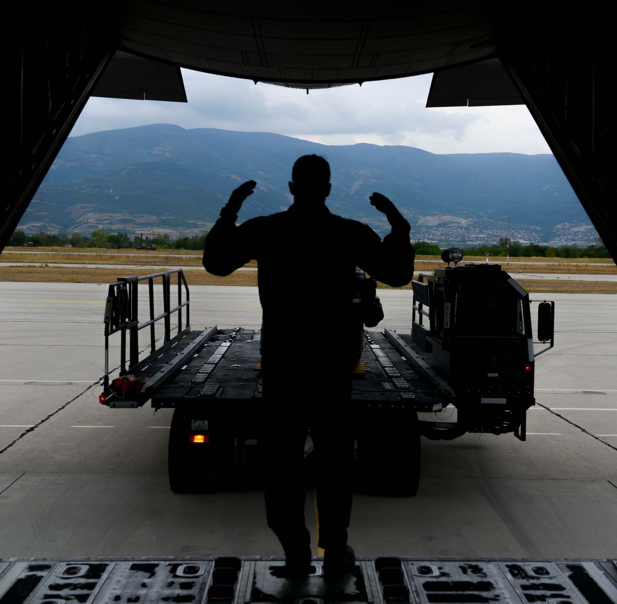 Staff Sgt. Jordan Callahan, 37th Airlift Squadron loadmaster, loads a cargo-delivery system onto a C-130J Super Hercules at Plovdiv Airport, Bulgaria during exercise Thracian Summer 2016, July 20, 2016. Through Exercise Thracian Summer, the United States and Bulgaria will enhance their mutual abilities to work together, with other NATO nations and with key regional partners on regional security, and help prepare Bulgaria for potential future operations in support of contingency operations around the world. The U.S. values the shared commitment and close cooperation with Bulgaria and other NATO allies on countering a range of regional and global threats. (U.S. Air Force photo/Senior Airman Nicole Keim)