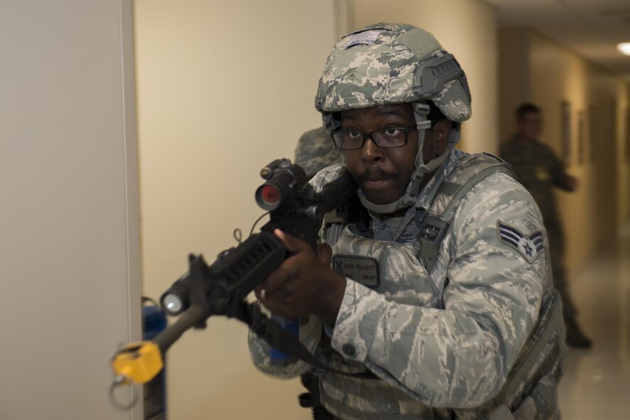 U.S. Air Force Senior Airman Earl Elliott, 23d Security Forces Squadron patrolman, advances down a hallway during an active-shooter exercise, July 20, 2016, at Moody Air Force Base, Ga. Airmen from the 23d SFS systematically cleared the building to ensure safety and timeliness. (U.S. Air Force photo by Airman Daniel Snider)