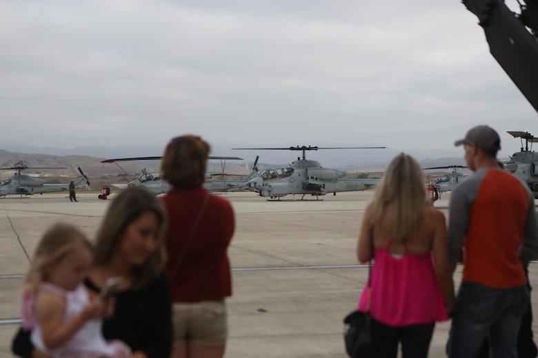 Marines and Sailors with Marine Light Attack Helicopter Training Squadron (HMLAT) 303, 3rd Marine Aircraft Wing;  5th Battalion, 11th Marine Regiment; and 2nd Battalion, 11th Marine Regiment, held a family day aboard Marine Corps Air Station Camp Pendleton, California, July 16. The squadron held the event to show the service members’ family and friends what they do every day to maintain mission readiness. (U.S. Marine Corps photo by Pfc. Liah Kitchen/Released)
 