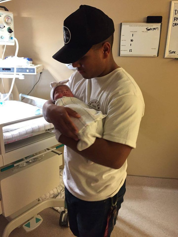 Army Spc. Julio Ramirez, a wheeled vehicle mechanic with the 17th Sustainment Brigade, holds his daughter, Isabella, born June 8, 2016. Courtesy photo