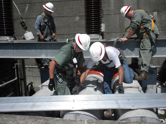 Maintenance workers at the Hartwell Power Plant perform repairs on Unit 5 during a scheduled biennial inspection in June 2016. The team improves operational efficiency by rehabilitating deficient generators in-house, cutting losses of up to $12,000 per day. Losses are calculated on the basis of imminent failure if issues aren't identified and addressed immediately, according to Ryan Hanna, a Hartwell Power Plant hydropower manager.  