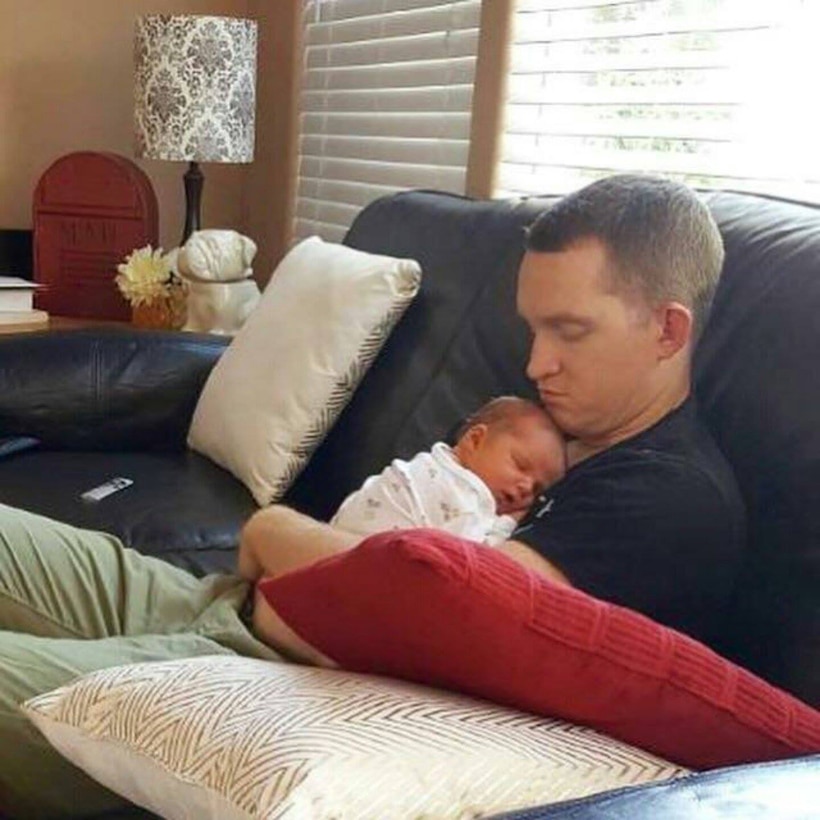 Army Sgt. Sean Holm, a chaplain’s assistant with the 17th Sustainment Brigade, holds his daughter, Adeline, born April 24, 2016. Courtesy photo